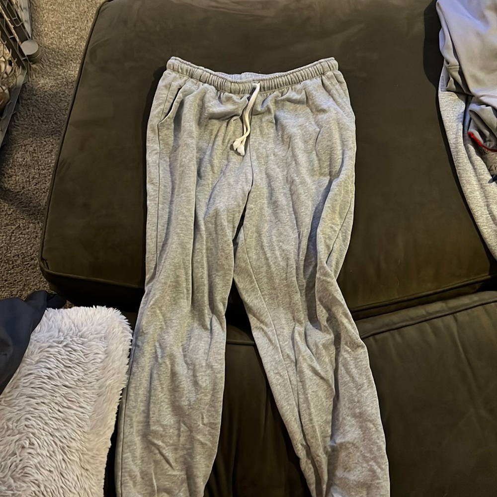 Cuffed ankles. Light grey comfy sweats